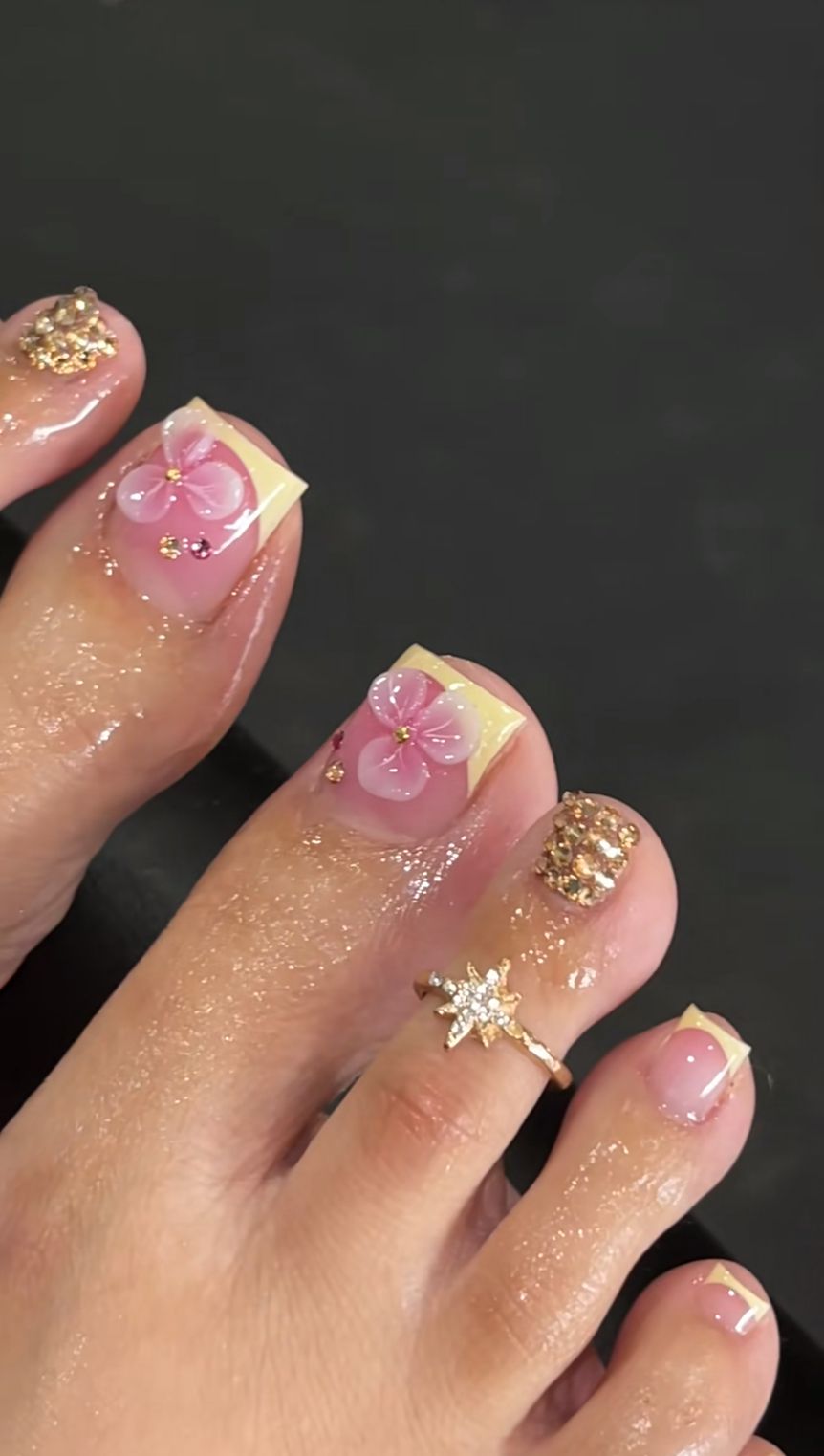 Yellow French pedicure with pink 3D flowers at Sola Nails Bouldin Creek 78704